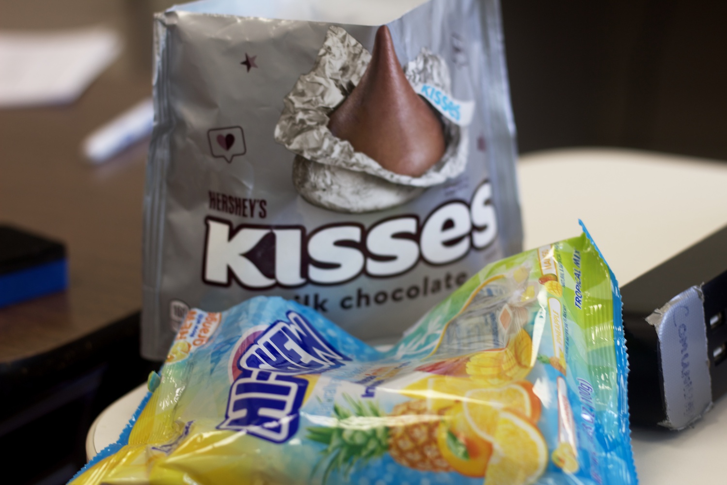 Bag of Hi-Chew next to Hershey's
  kisses